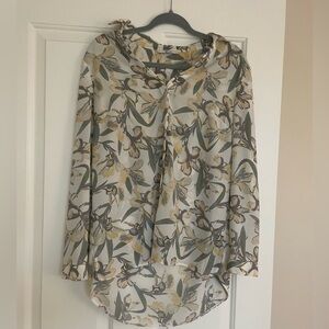 Blouse with a floral pattern.